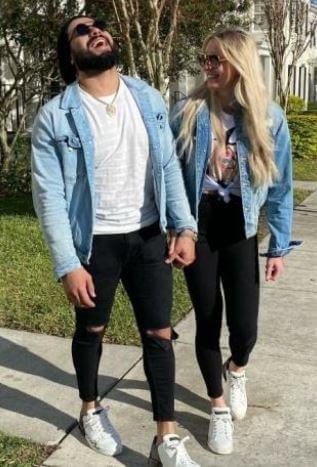 Riki Johnson ex wife Charlotte Flair with Andrade.